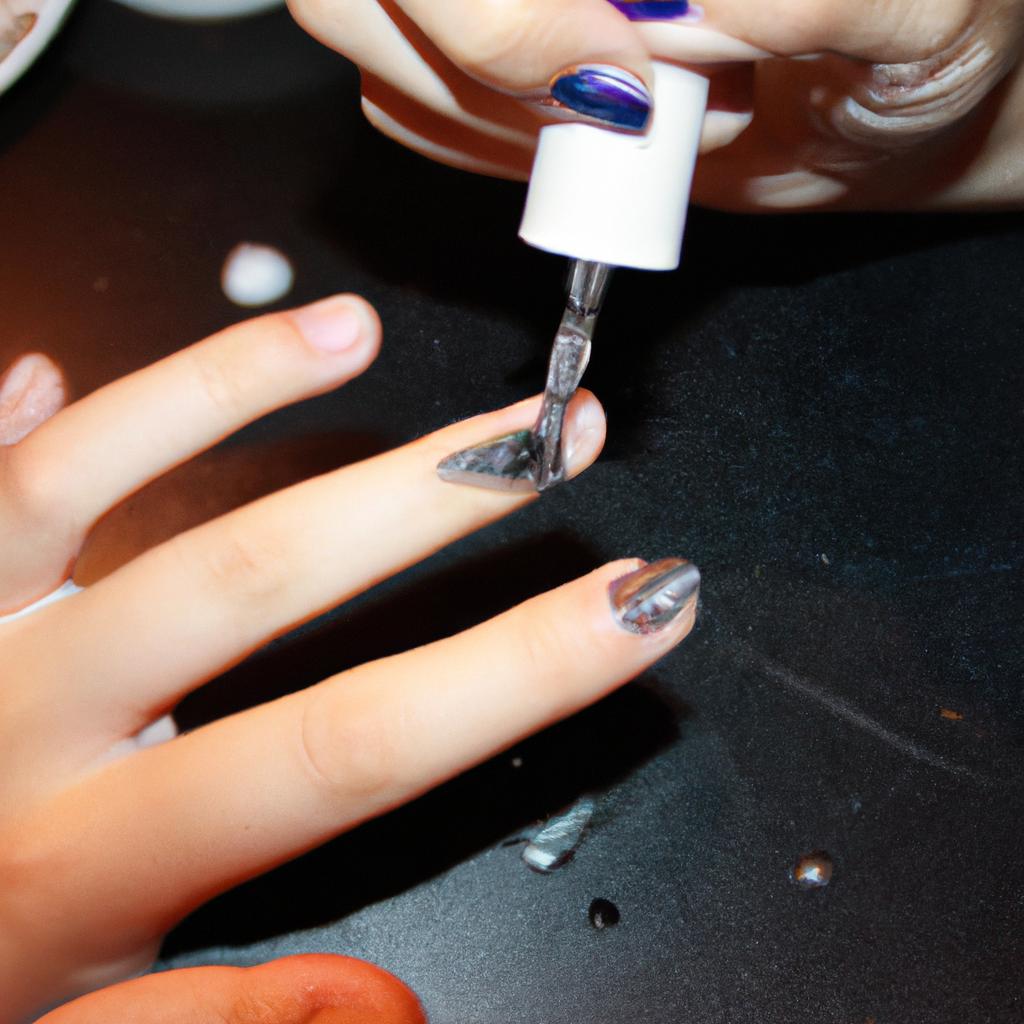 Person applying acrylic nail extensions