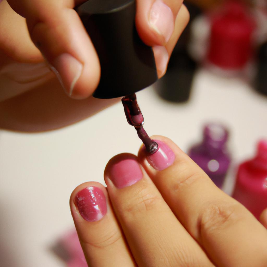 Person applying nail polish professionally